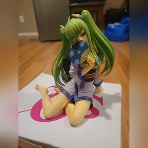 Green-Haired Anime Figure with Fan